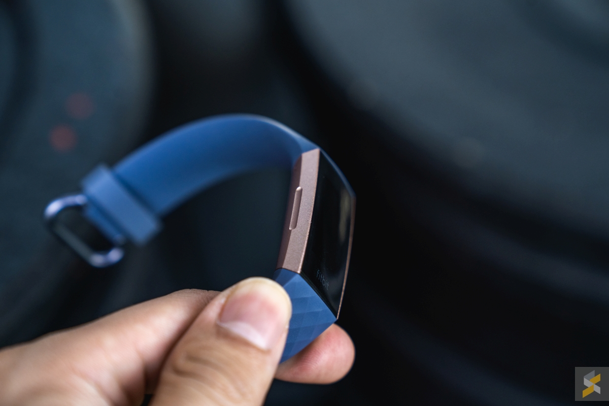 where is the button on fitbit charge 3