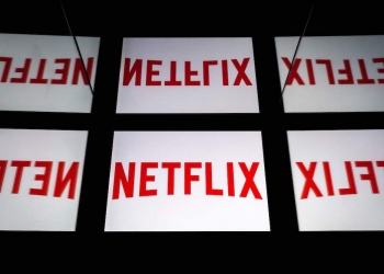 (FILES) In this file photo taken on February 18, 2019 This illustration picture shows the US Online Streaming giant Netflix logo displayed on a tablet in Paris. - Some of the biggest names in media and tech are gearing up to move into streaming, in what could be a major challenge to market leader Netflix. Apple is expected to make its move with an announcement March 25 on its media plans, with a war chest estimated at some $1 billion and partners including stars like Jennifer Aniston and director J.J. Abrams involved in content. (Photo by Lionel BONAVENTURE / AFP)