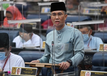 Tengku Datuk Seri Zafrul Abdul Aziz delivering Budget 2021 in Parliament.