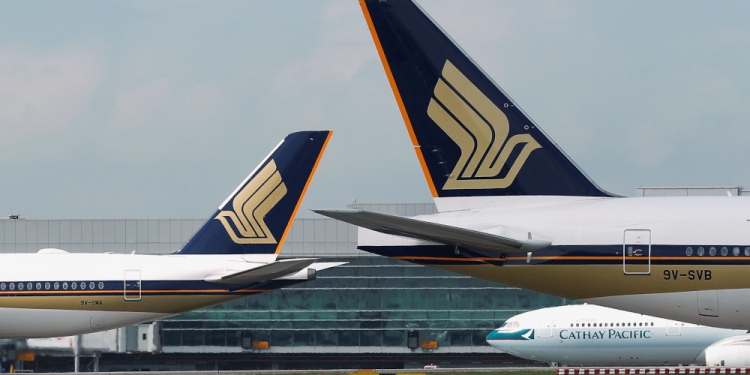 FILE PHOTO: Singapore Airlines planes are pictured on the tarmac at Changi Airport, Singapore March 28, 2018. REUTERS/Edgar Su/File Photo