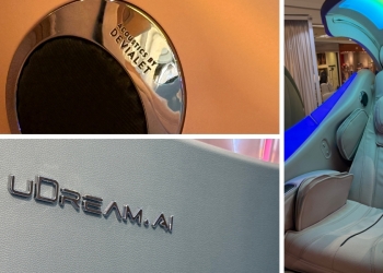 OSIM uDream·AI Well-Being Chair in a modern living room setting, featuring a Red Dot Award 2026 winning design inspired by the Chambered Nautilus.